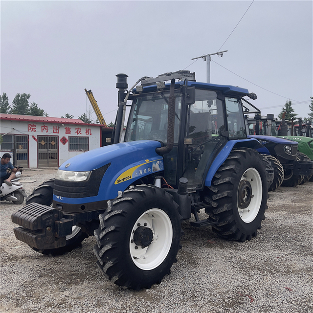 100HP تستخدم New Holland SNH1004 جرار 4WD مع كابينة