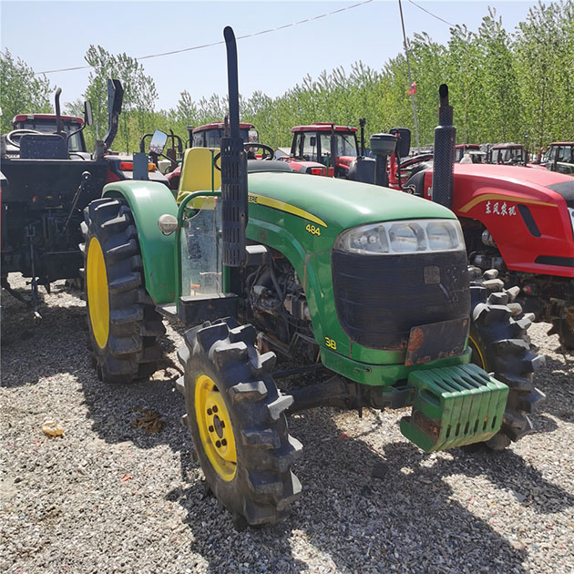 مستعملة جرار John Deere 484 مع لوادر النهاية الأمامية